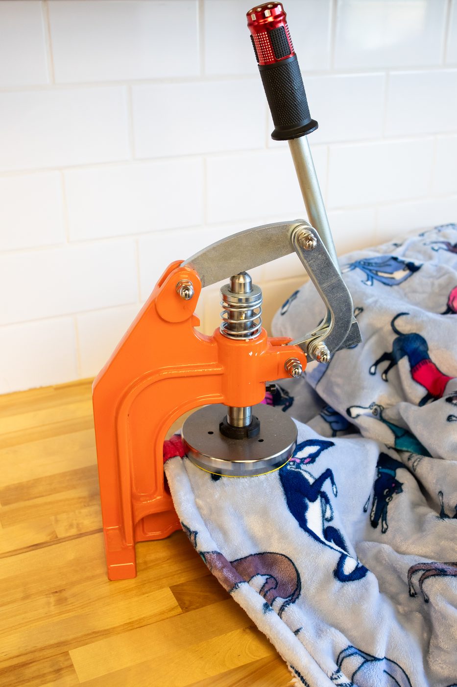 Cutting die used to punch a fabric density test swatch from a blanket hoodie